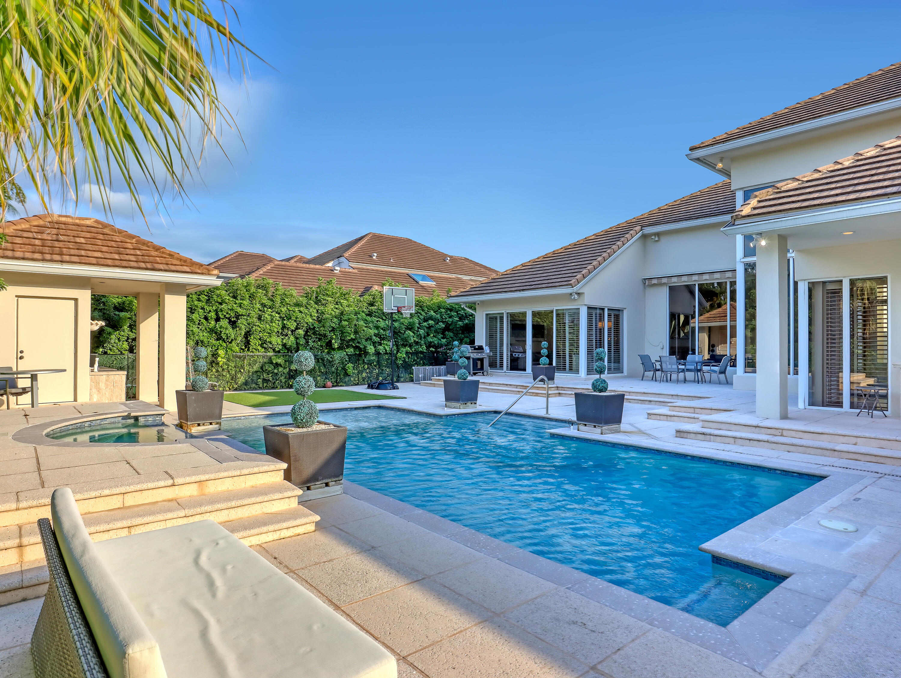 7207 Valencia Drive Boca Raton, FL 33433 - Photo 29 of 32 a view of a house with swimming pool and sitting area