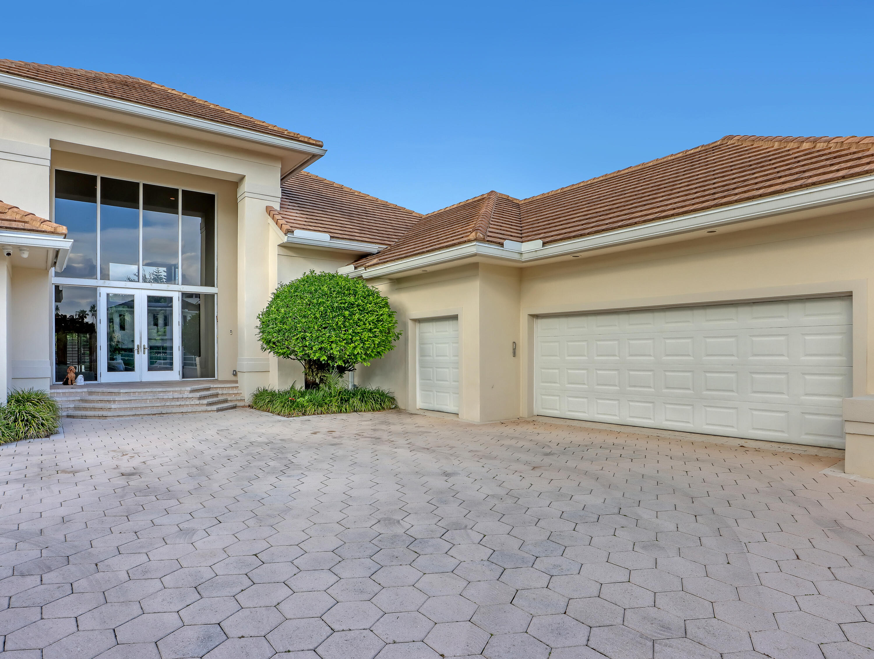7207 Valencia Drive Boca Raton, FL 33433 - Photo 4 of 32 a view of a house with a yard and garage
