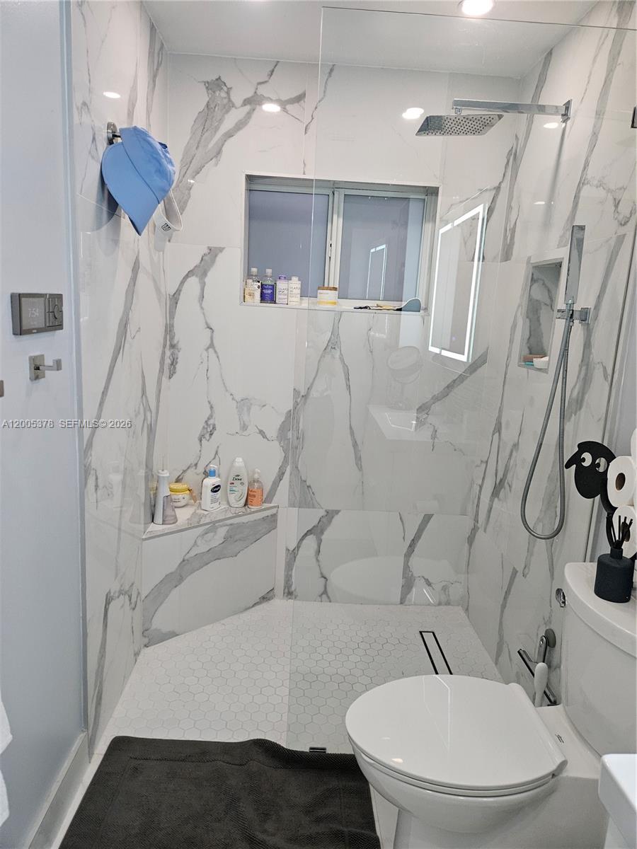 16314 Southwest 97th Street Miami, FL 33196 - Photo 23 of 41 a bathroom with a sink and a mirror
