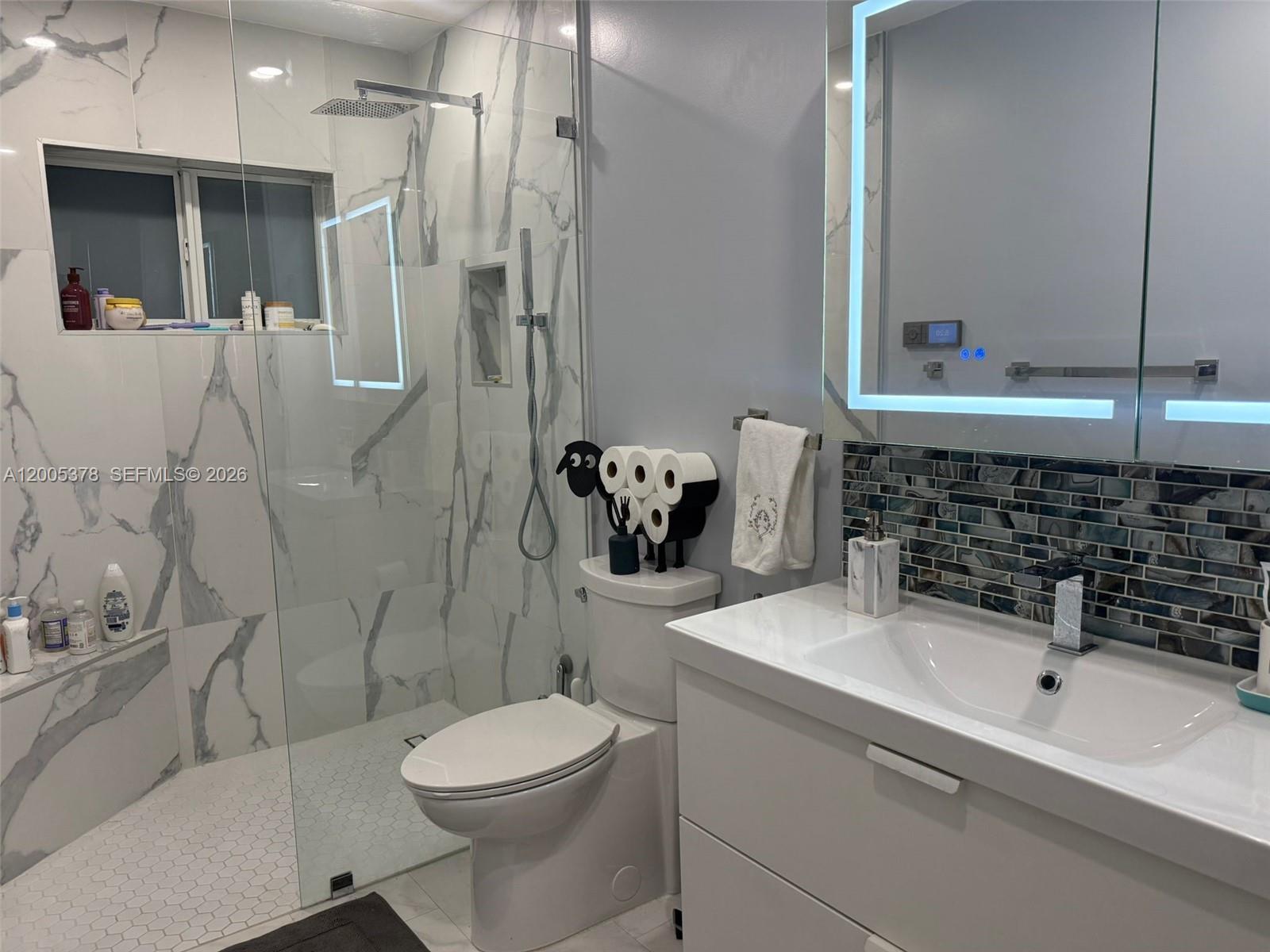 16314 Southwest 97th Street Miami, FL 33196 - Photo 24 of 41 a bathroom with a sink toilet and shower