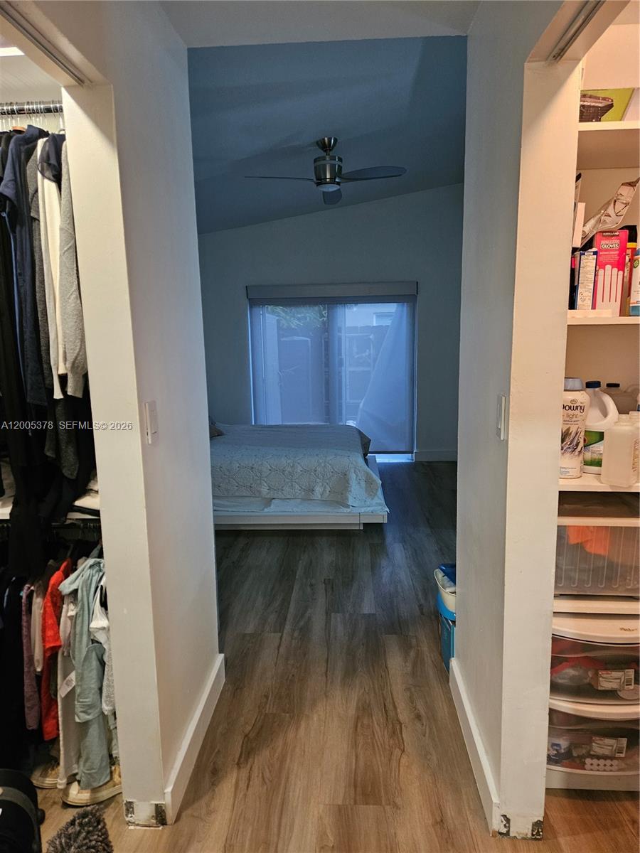 16314 Southwest 97th Street Miami, FL 33196 - Photo 26 of 41 a view of a hallway with wooden floor and closet