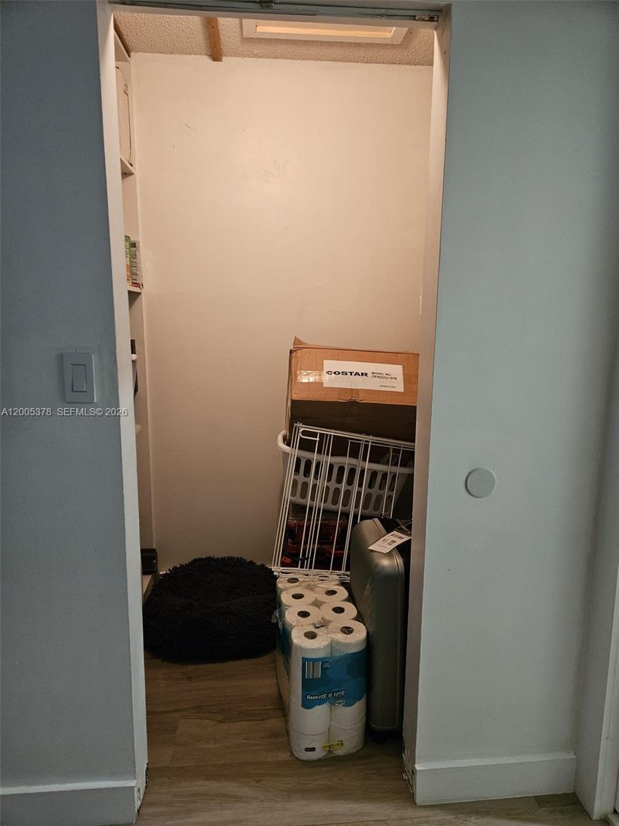 16314 Southwest 97th Street Miami, FL 33196 - Photo 28 of 41 a room with a chair and a wooden door