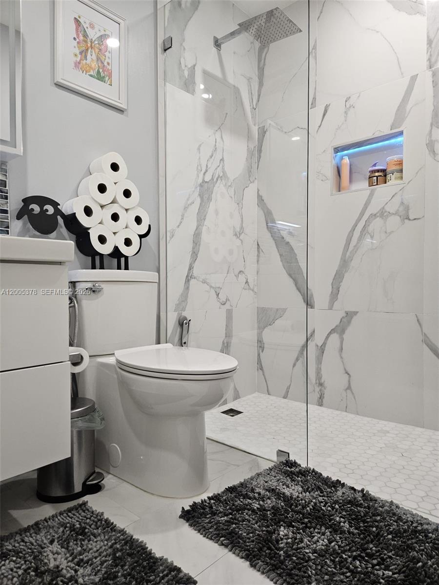16314 Southwest 97th Street Miami, FL 33196 - Photo 32 of 41 a bathroom with a sink toilet and mirror
