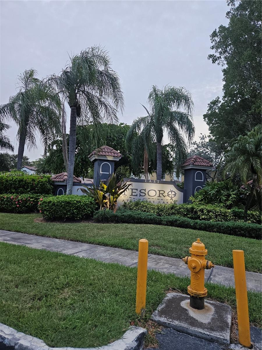 16314 Southwest 97th Street Miami, FL 33196 - Photo 41 of 41 a front view of a house with a yard fountain and fountain