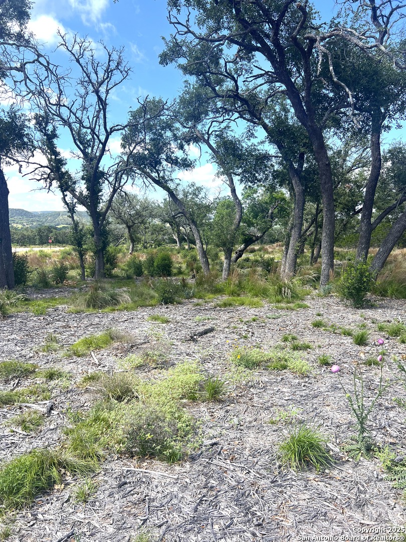 0 Citadel Center Point Kerrville, TX 78028 - Photo 30 of 33 a backyard of a house with a yard and outdoor seating