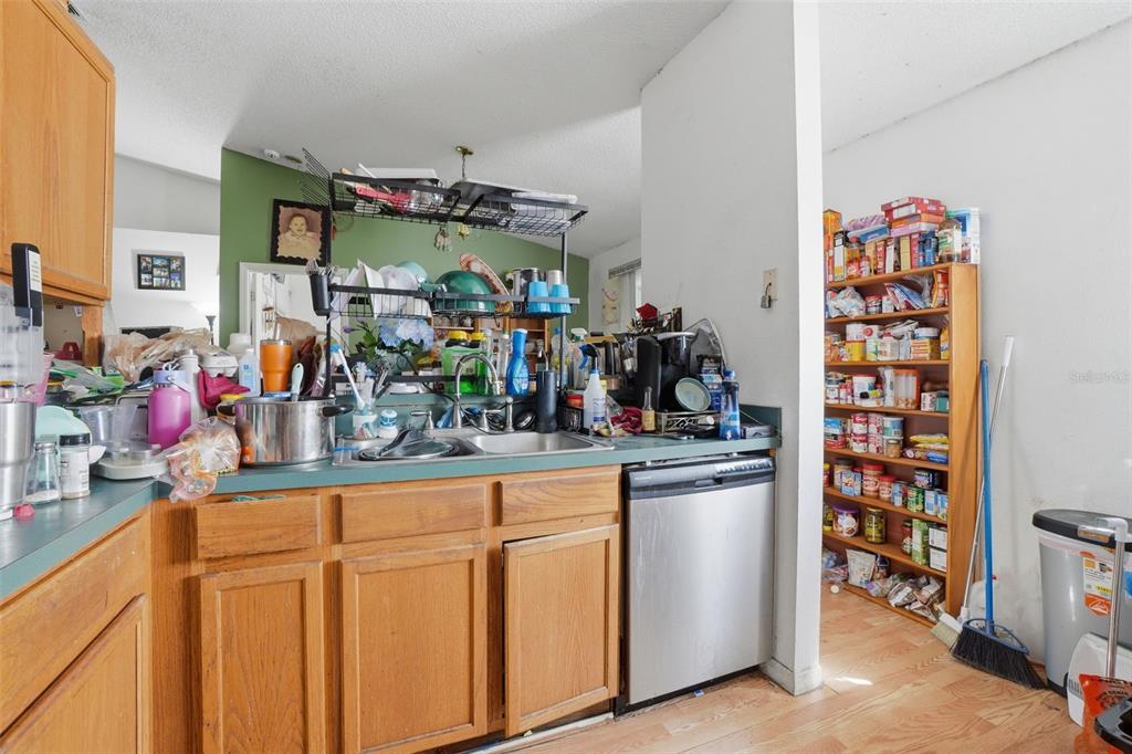 1650 East Welch Road Apopka, FL 32712 - Photo 15 of 29 a kitchen with stainless steel appliances granite countertop a sink and cabinets