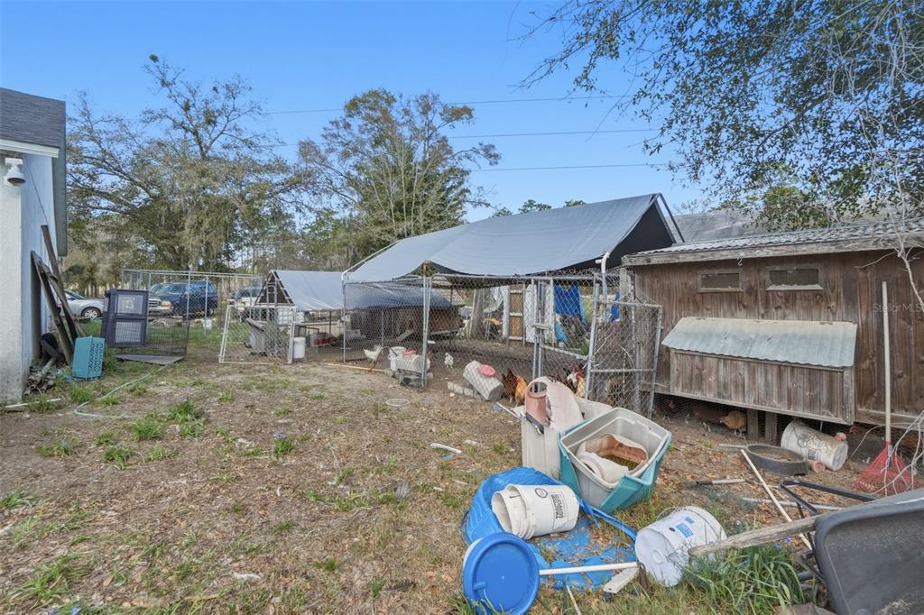 1650 East Welch Road Apopka, FL 32712 - Photo 27 of 29 a backyard of a house with table and chairs