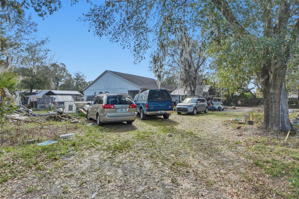 1650 East Welch Road Apopka, FL 32712 - Photo 3 of 29 a car parked in front of a house