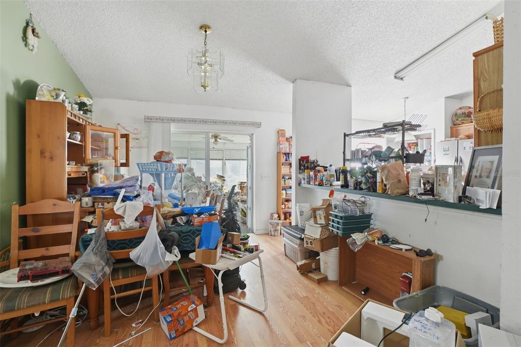 1650 East Welch Road Apopka, FL 32712 - Photo 10 of 29 a room with gym equipment and wooden floor