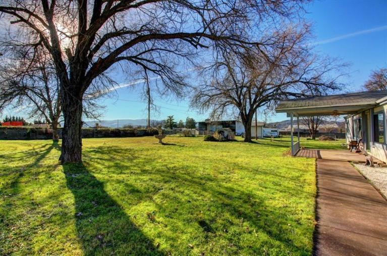 8085 High Banks Road Central Point, OR 97502 - Photo 5 of 35 a view of a yard with swimming pool