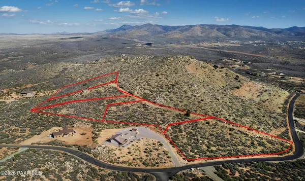 a view of a town with mountains in the background