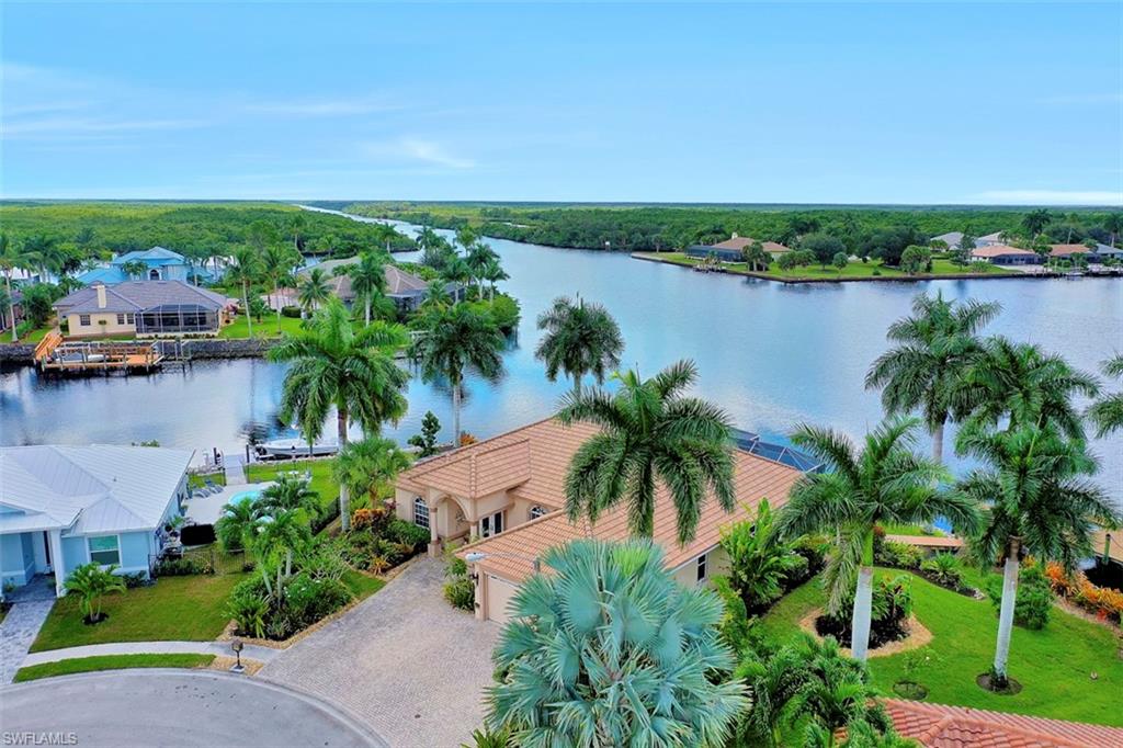 a view of a lake with houses in the back