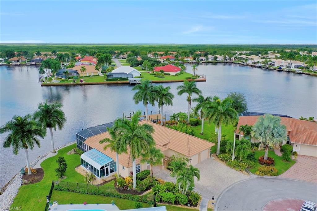 134 Windward Cay Naples, FL 34114 - Photo 11 of 35 an aerial view of lake and residential houses with outdoor space