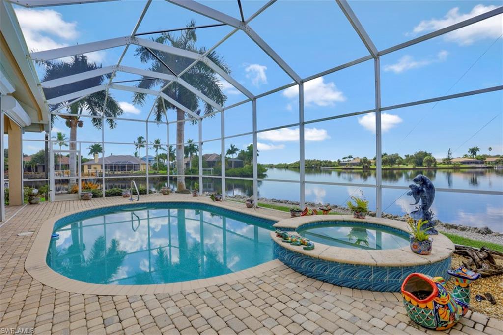 134 Windward Cay Naples, FL 34114 - Photo 20 of 35 a view of a swimming pool with a porch