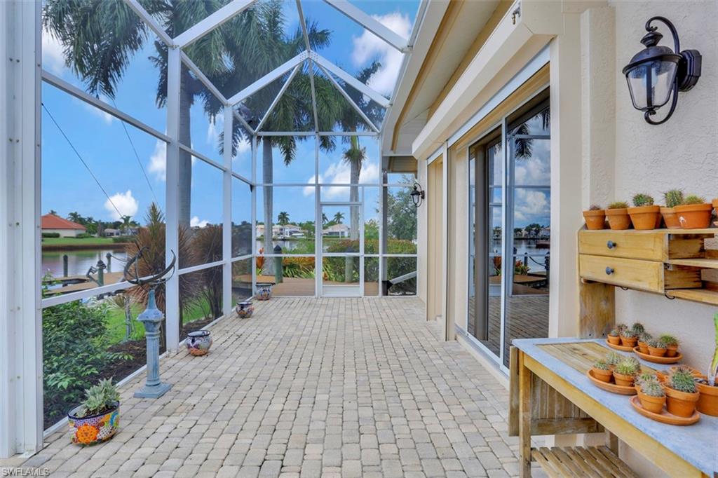 134 Windward Cay Naples, FL 34114 - Photo 21 of 35 a view of a house with backyard and porch