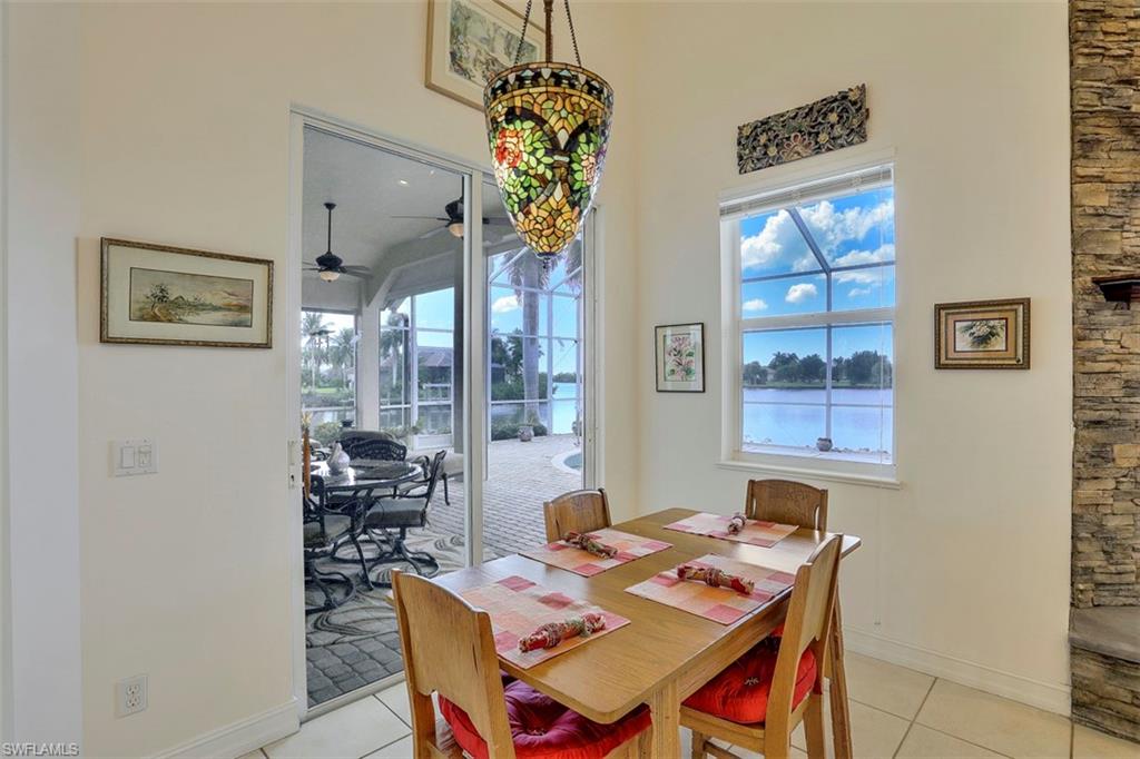 134 Windward Cay Naples, FL 34114 - Photo 27 of 35 a view of a dining room with furniture window and outside view