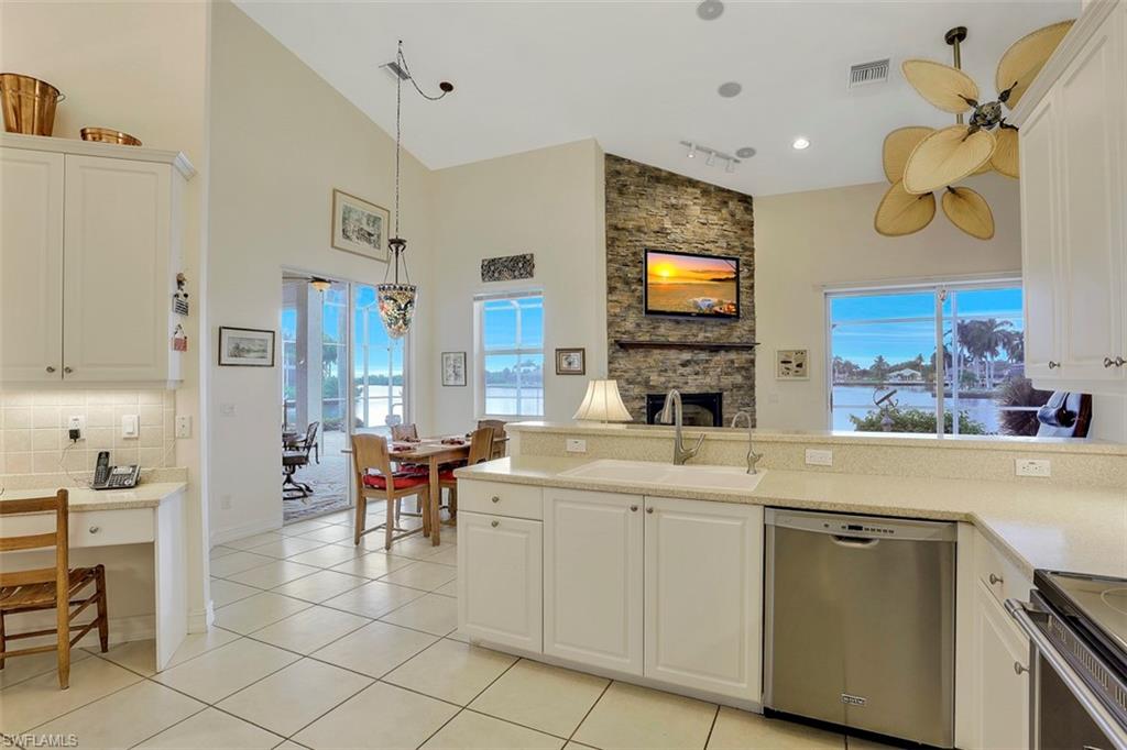 134 Windward Cay Naples, FL 34114 - Photo 28 of 35 a view of living room with furniture and flat screen tv