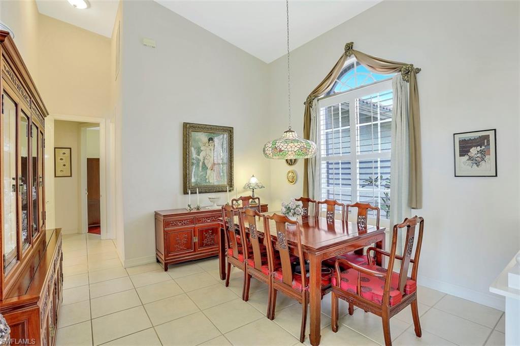 134 Windward Cay Naples, FL 34114 - Photo 35 of 35 a living room with furniture and a window