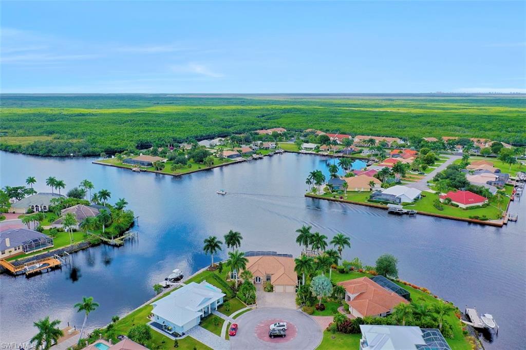134 Windward Cay Naples, FL 34114 - Photo 4 of 35 an aerial view of a house with a garden