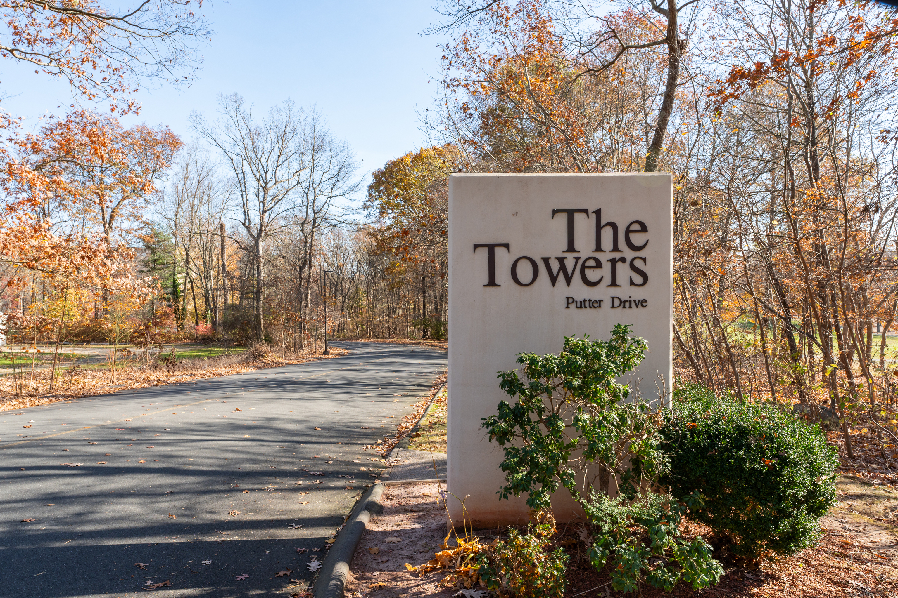 69 Putter Drive, Unit 210 Wallingford, CT 06492 - Photo 1 of 1 a sign that is on the side of the road