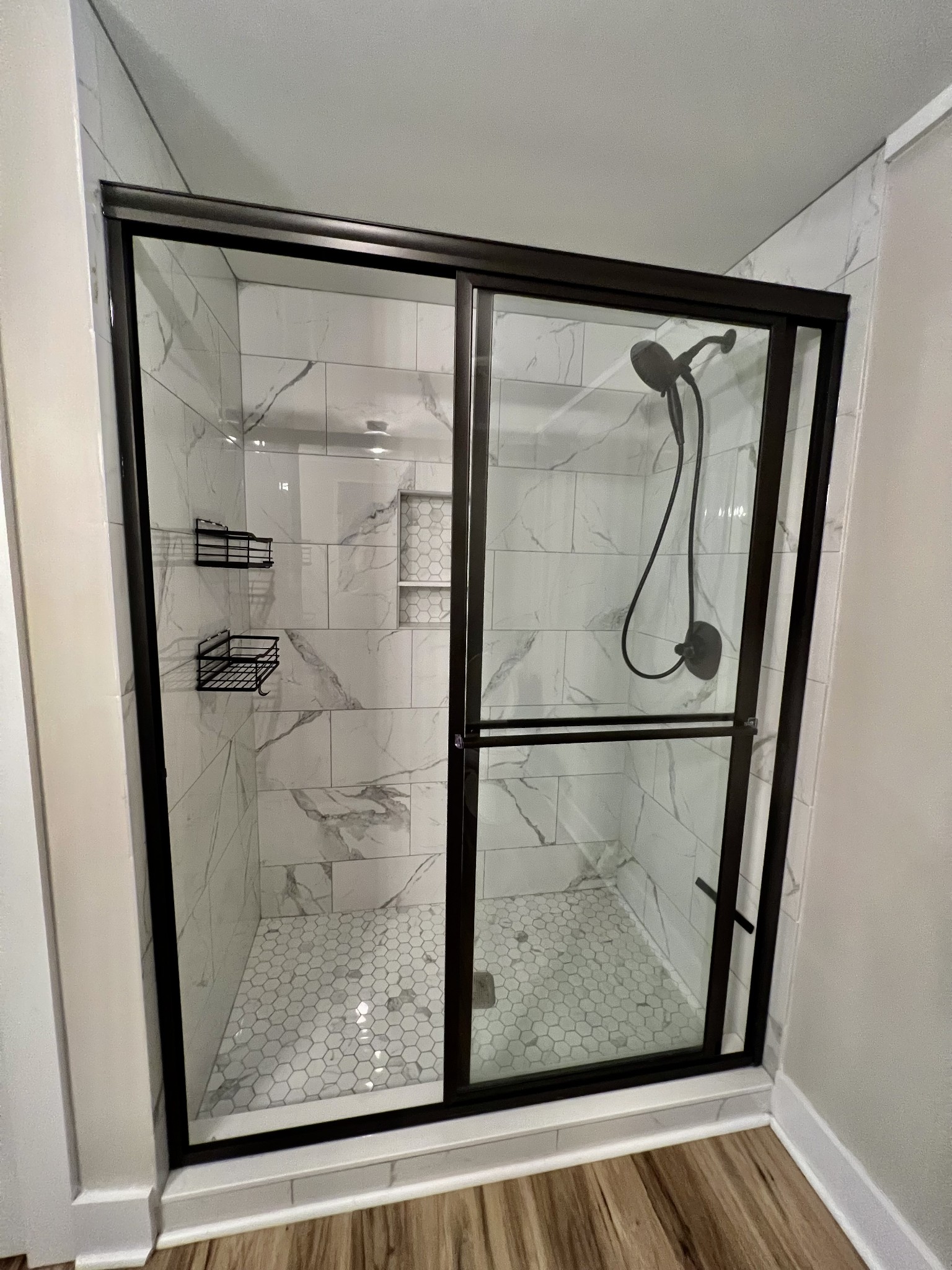 114 Barber Road Unionville, TN 37180 - Photo 16 of 36 a bathroom with a glass shower door