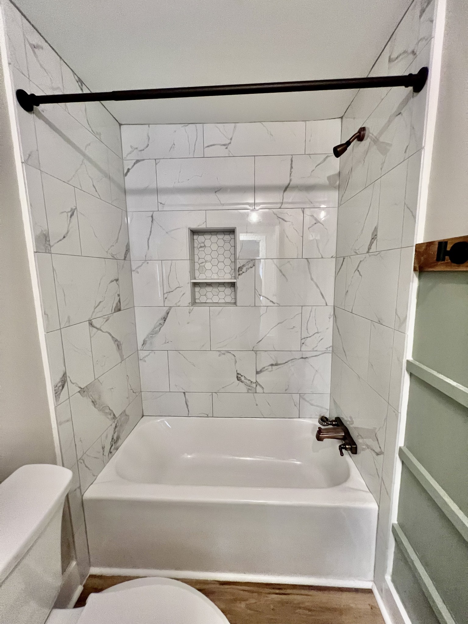 114 Barber Road Unionville, TN 37180 - Photo 23 of 36 a bathroom with a shower and a white bath tub
