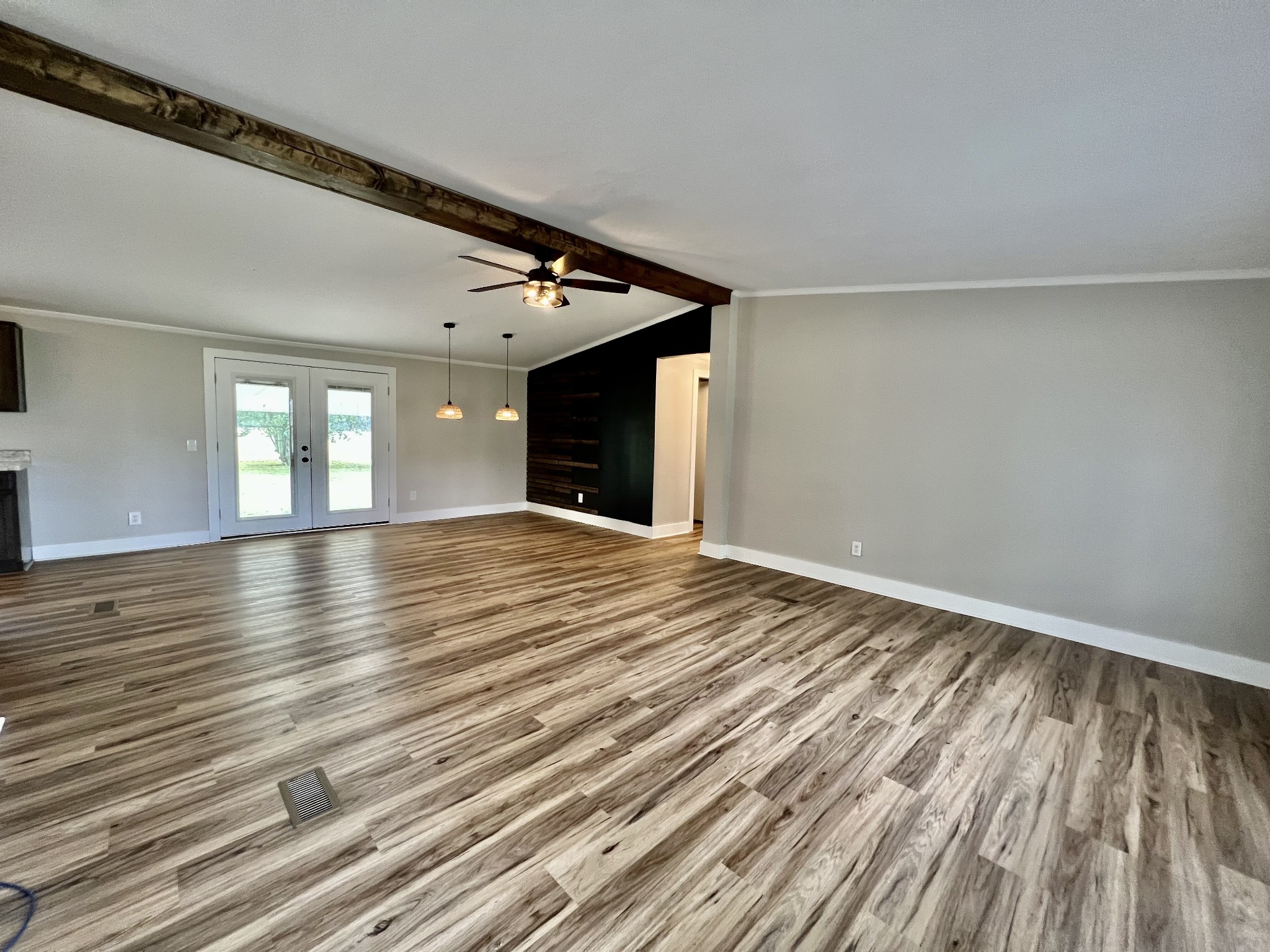 114 Barber Road Unionville, TN 37180 - Photo 3 of 36 a view of an empty room with window and wooden floor