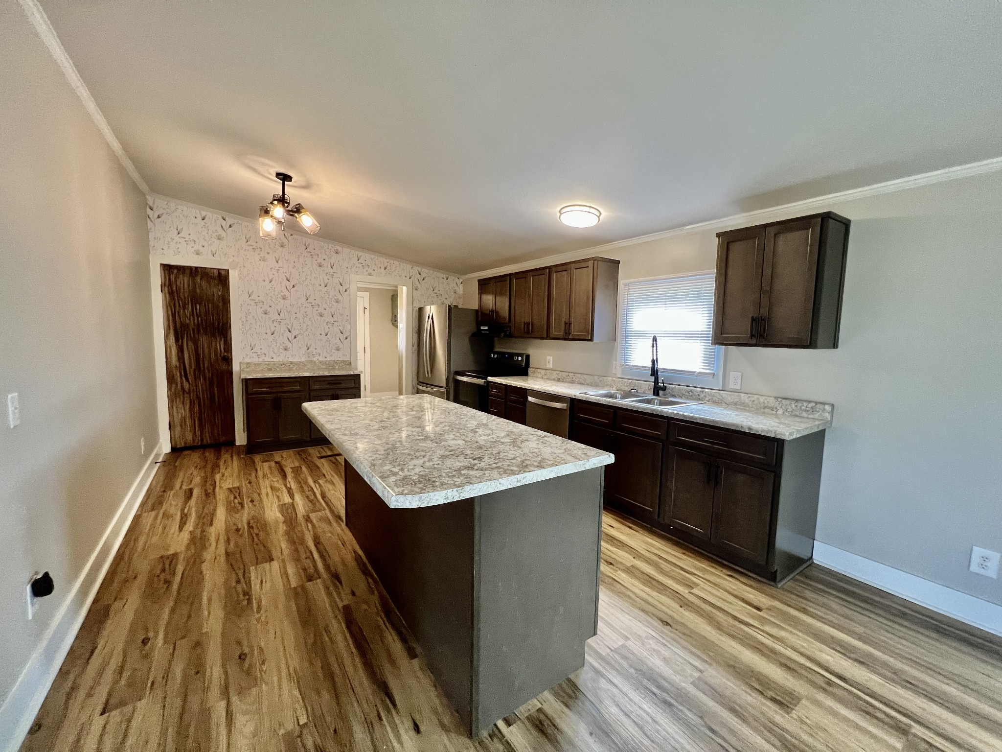 114 Barber Road Unionville, TN 37180 - Photo 8 of 36 a kitchen with sink a microwave and refrigerator