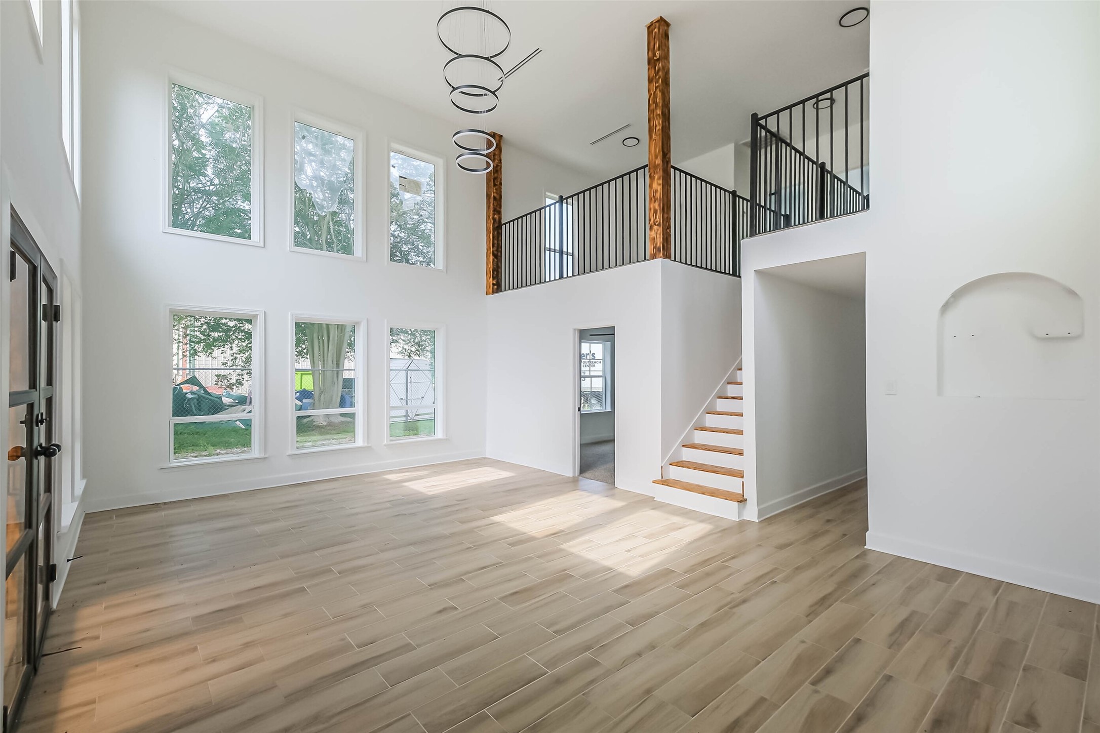 11019 Clodine Road Sugar Land, TX 77498 - Photo 26 of 39 a view of an entryway with wooden floor and windows