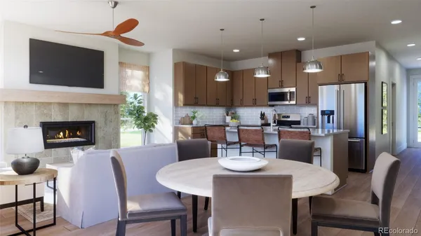 a kitchen with a dining table chairs and refrigerator