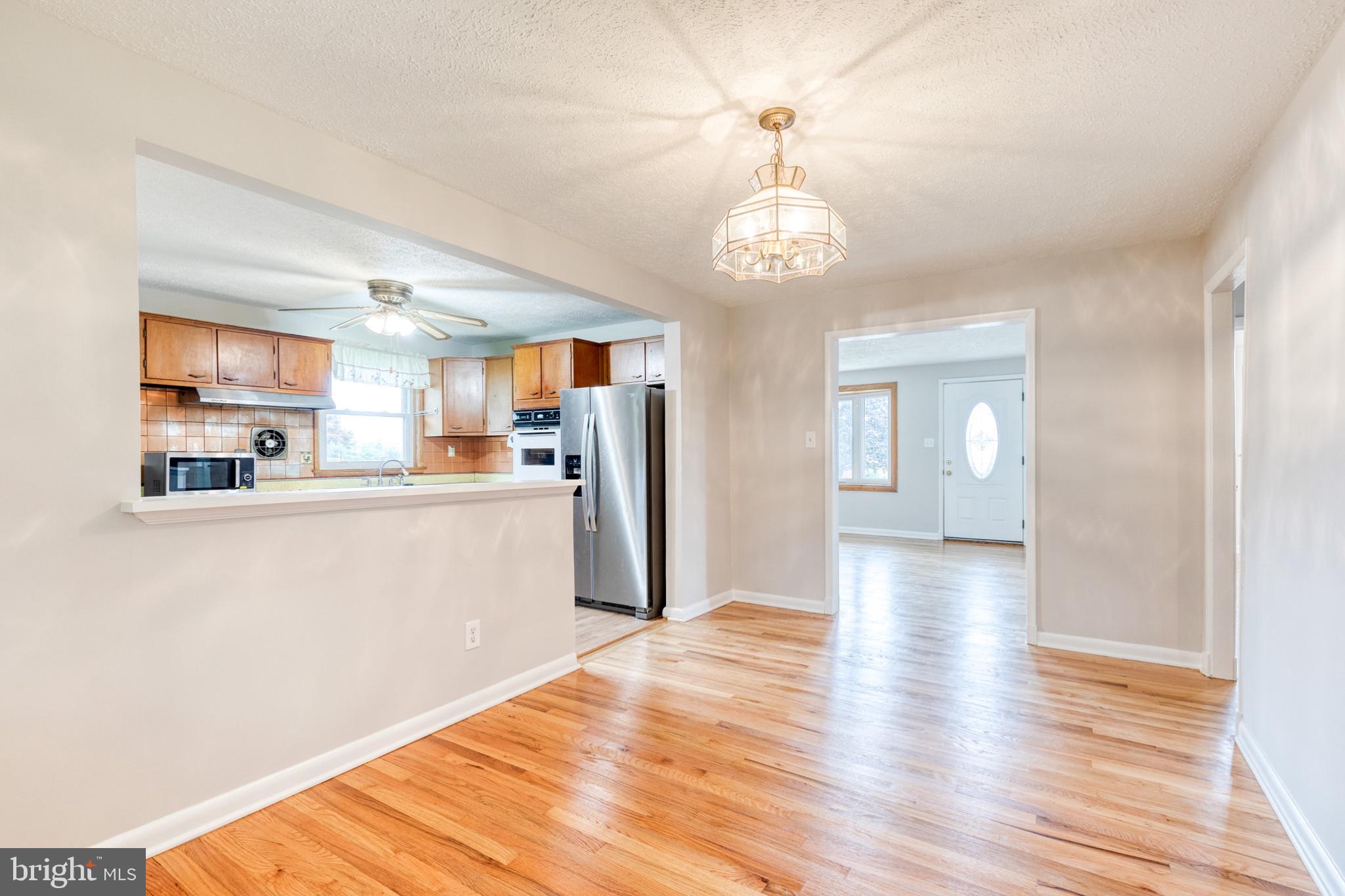 8306 Berkfield Road Baltimore, MD 21237 - Photo 12 of 29 Bright and airy open living space.