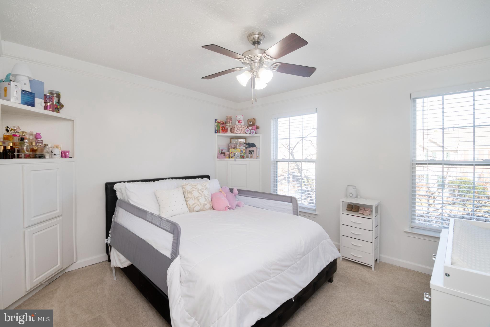 8310 Water Lily Way Laurel, MD 20724 - Photo 16 of 31 a bedroom with a bed and a window