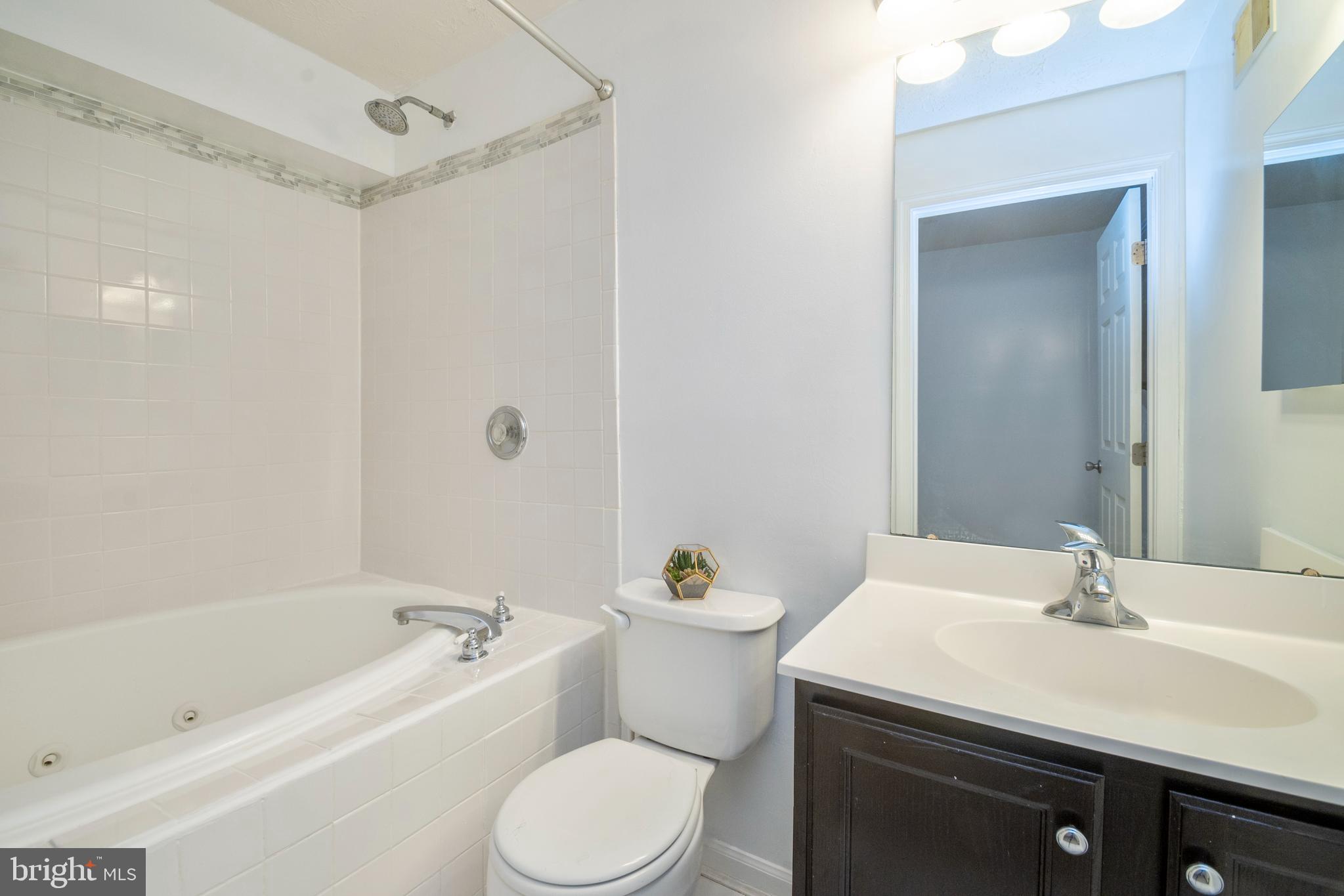 8310 Water Lily Way Laurel, MD 20724 - Photo 17 of 31 a bathroom with a sink a toilet and a bathtub