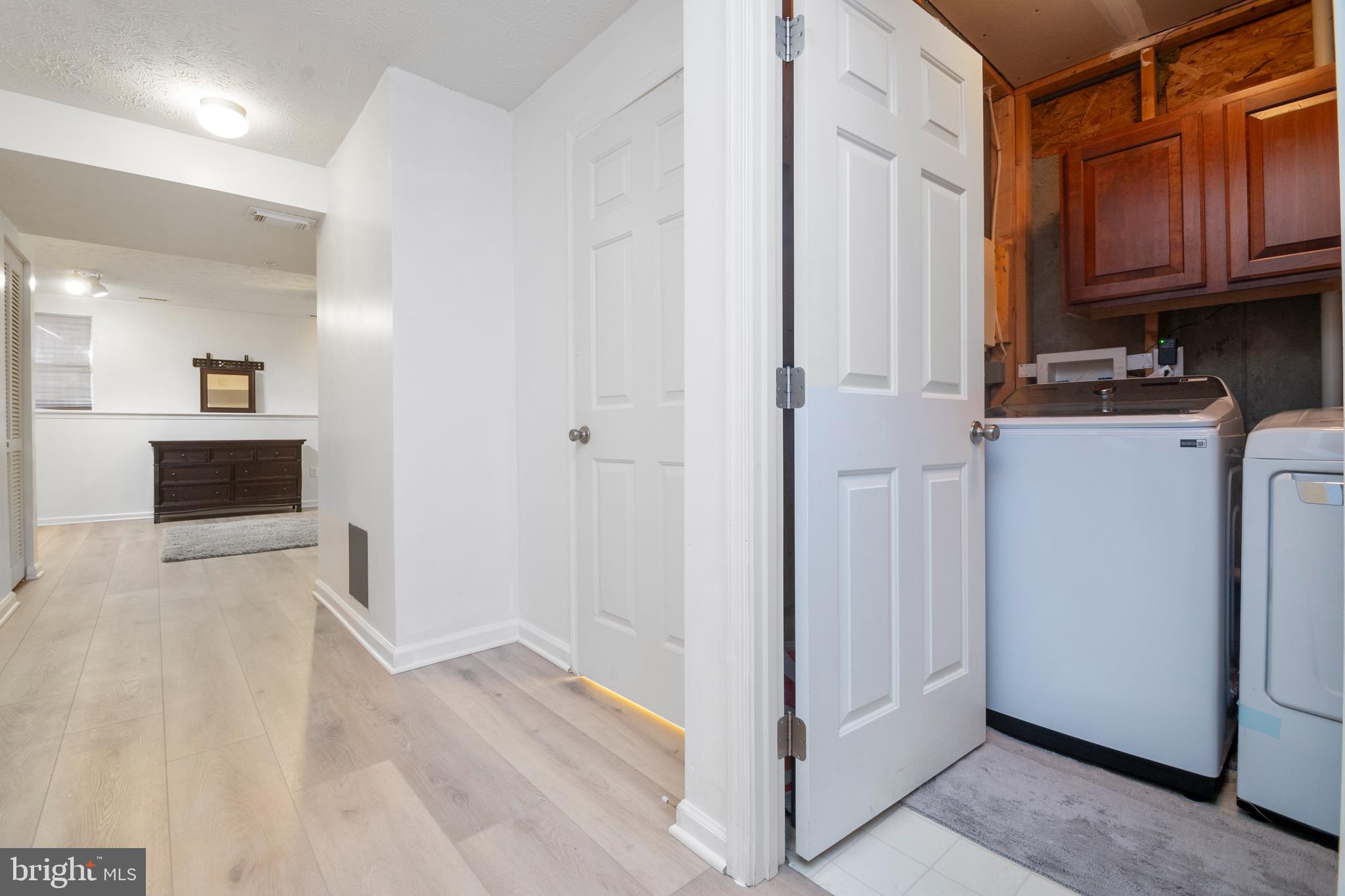 8310 Water Lily Way Laurel, MD 20724 - Photo 20 of 31 a view of a storage & utility room with wooden floor