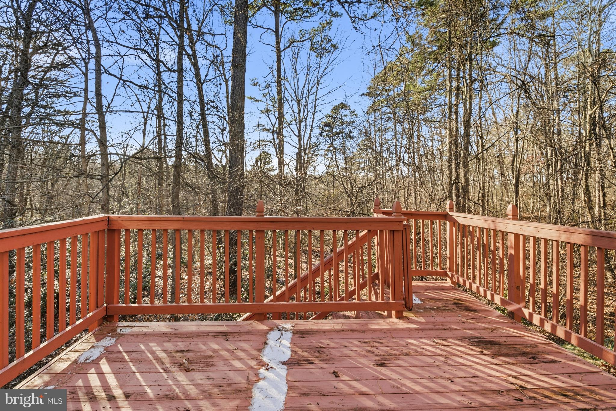 8310 Water Lily Way Laurel, MD 20724 - Photo 23 of 31 a balcony with wooden floor and trees