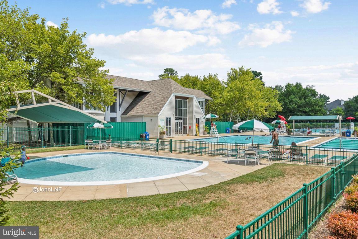 8310 Water Lily Way Laurel, MD 20724 - Photo 26 of 31 a view of a house with swimming pool and sitting area