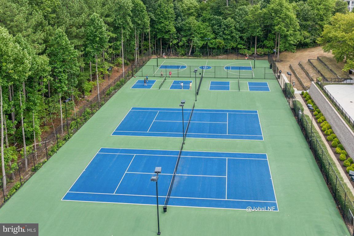 8310 Water Lily Way Laurel, MD 20724 - Photo 28 of 31 a view of a tennis ground with large trees