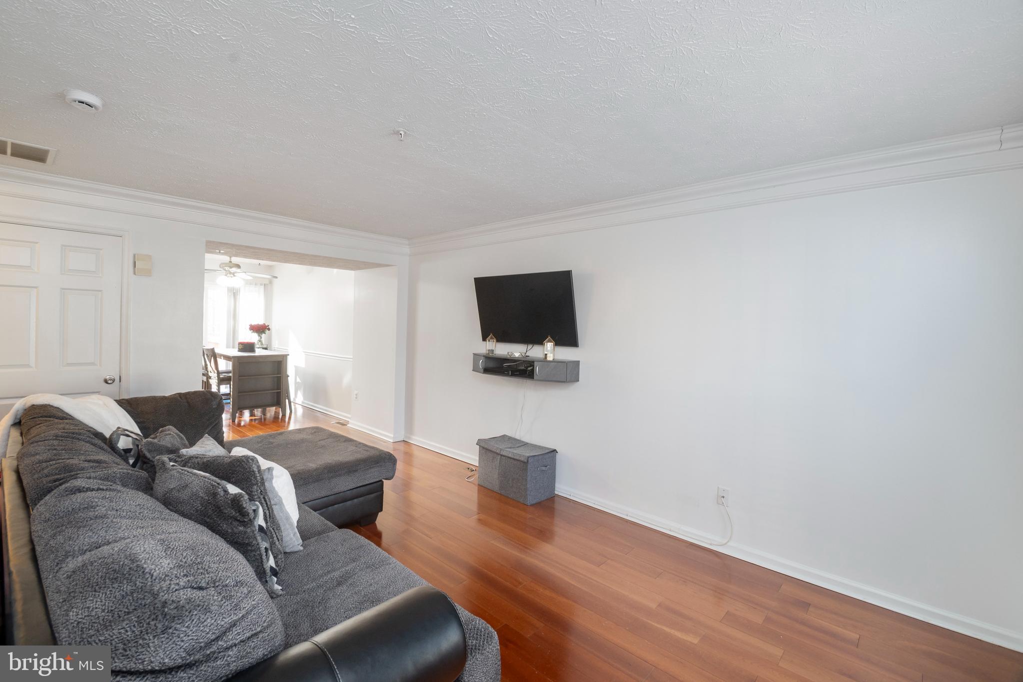8310 Water Lily Way Laurel, MD 20724 - Photo 3 of 31 a living room with furniture and a flat screen tv