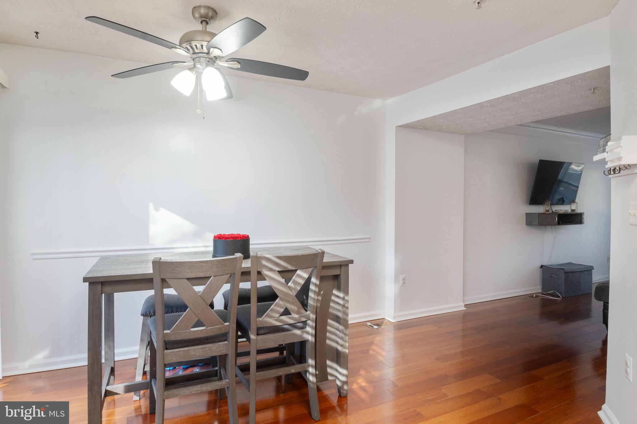8310 Water Lily Way Laurel, MD 20724 - Photo 7 of 31 a view of a dining room with furniture and wooden floor