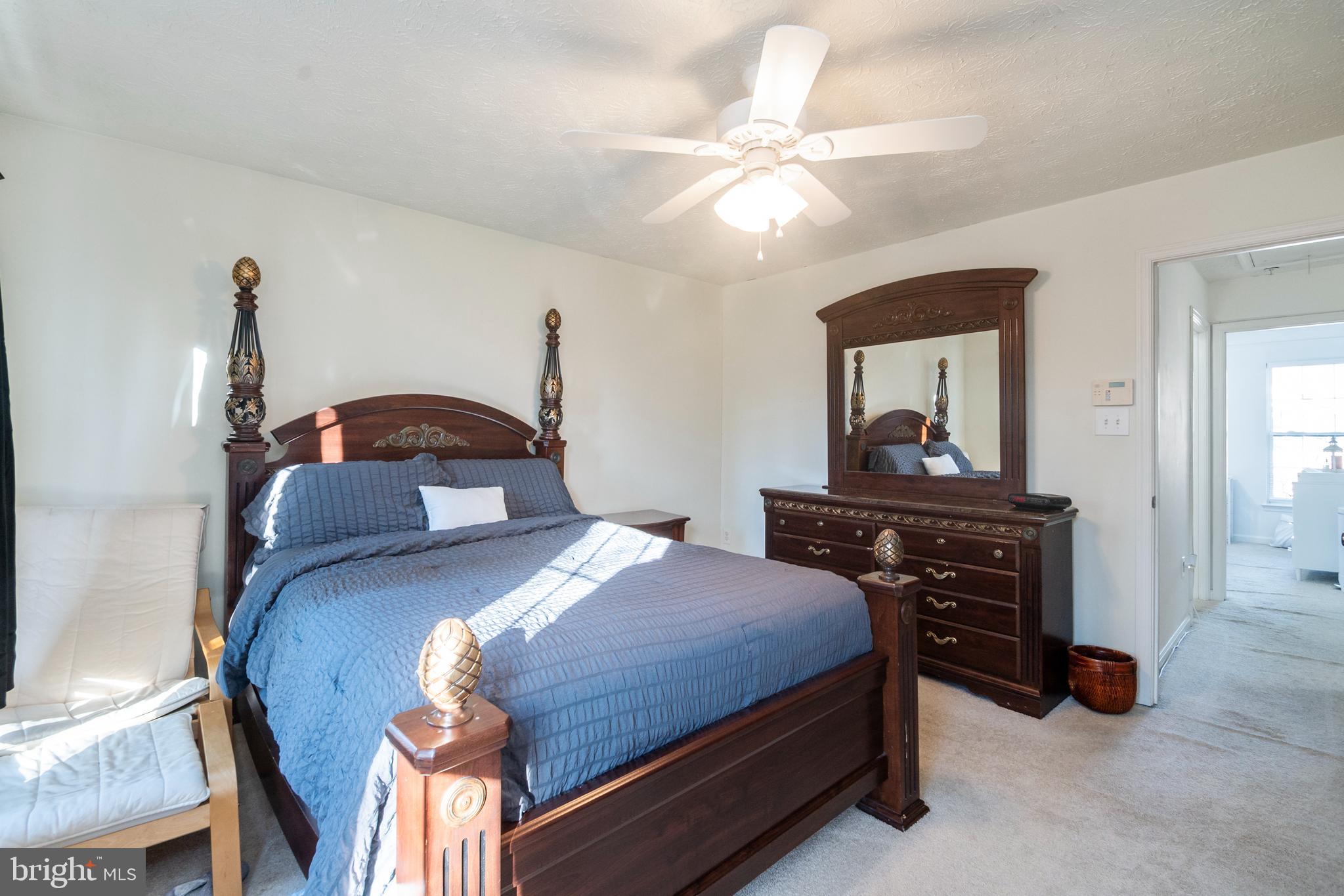 8310 Water Lily Way Laurel, MD 20724 - Photo 10 of 31 a bedroom with a bed and a dresser