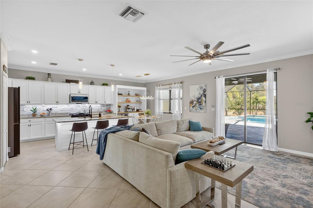 17619 Blue Rdg Place Bradenton, FL 34211 - Photo 17 of 98 a living room with furniture kitchen view and a large window