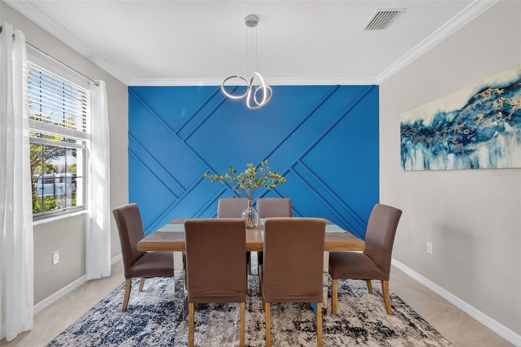 17619 Blue Rdg Place Bradenton, FL 34211 - Photo 18 of 98 a view of a dining room with furniture window and wooden floor