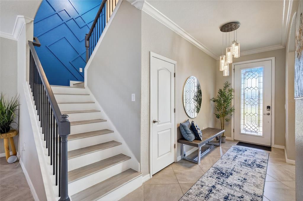 17619 Blue Rdg Place Bradenton, FL 34211 - Photo 21 of 98 a view of a hallway with entryway wooden floor and front door