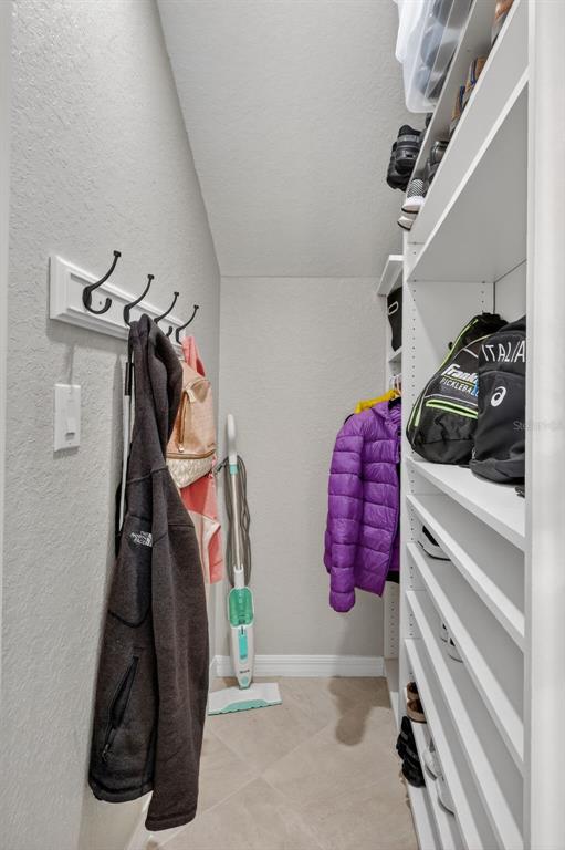 17619 Blue Rdg Place Bradenton, FL 34211 - Photo 22 of 98 a view of walk in closet with clothes and shoes