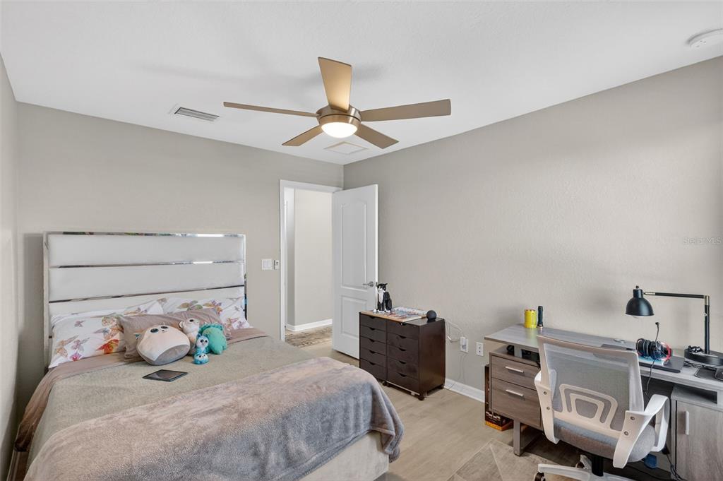 17619 Blue Rdg Place Bradenton, FL 34211 - Photo 33 of 98 a bedroom with a bed and a chandelier