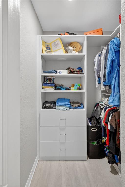 17619 Blue Rdg Place Bradenton, FL 34211 - Photo 34 of 98 a view of walk in closet with clothes and shoes