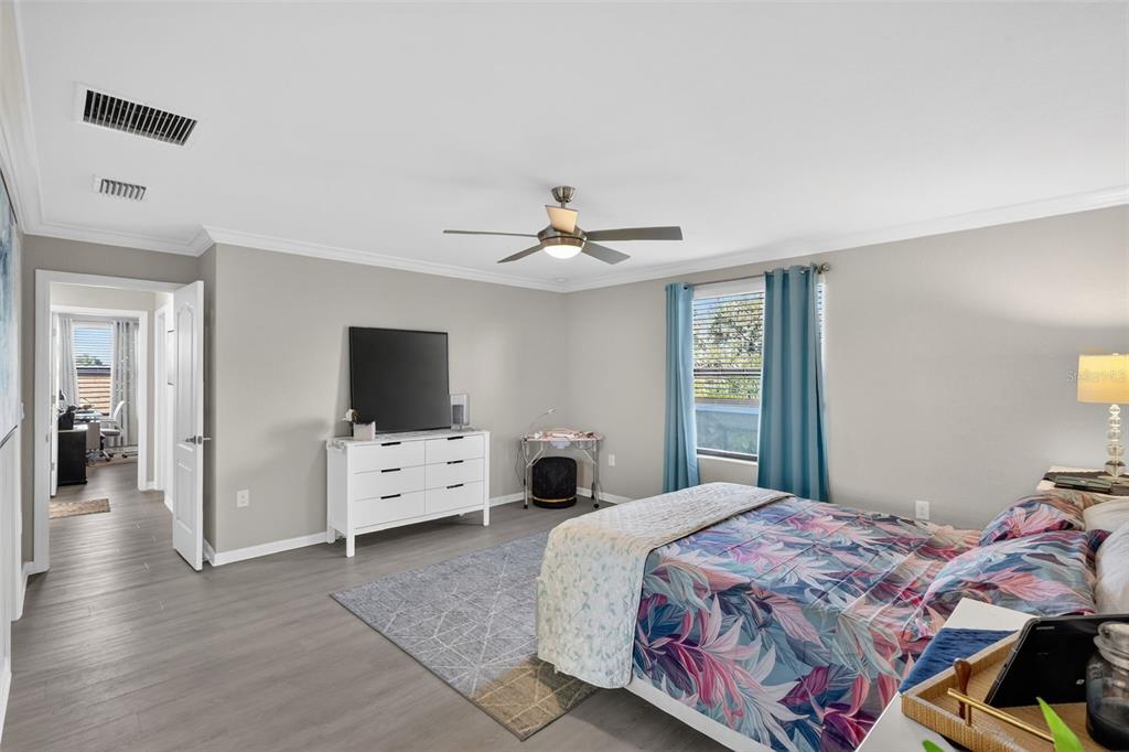 17619 Blue Rdg Place Bradenton, FL 34211 - Photo 40 of 98 a bedroom with a bed and a flat screen tv