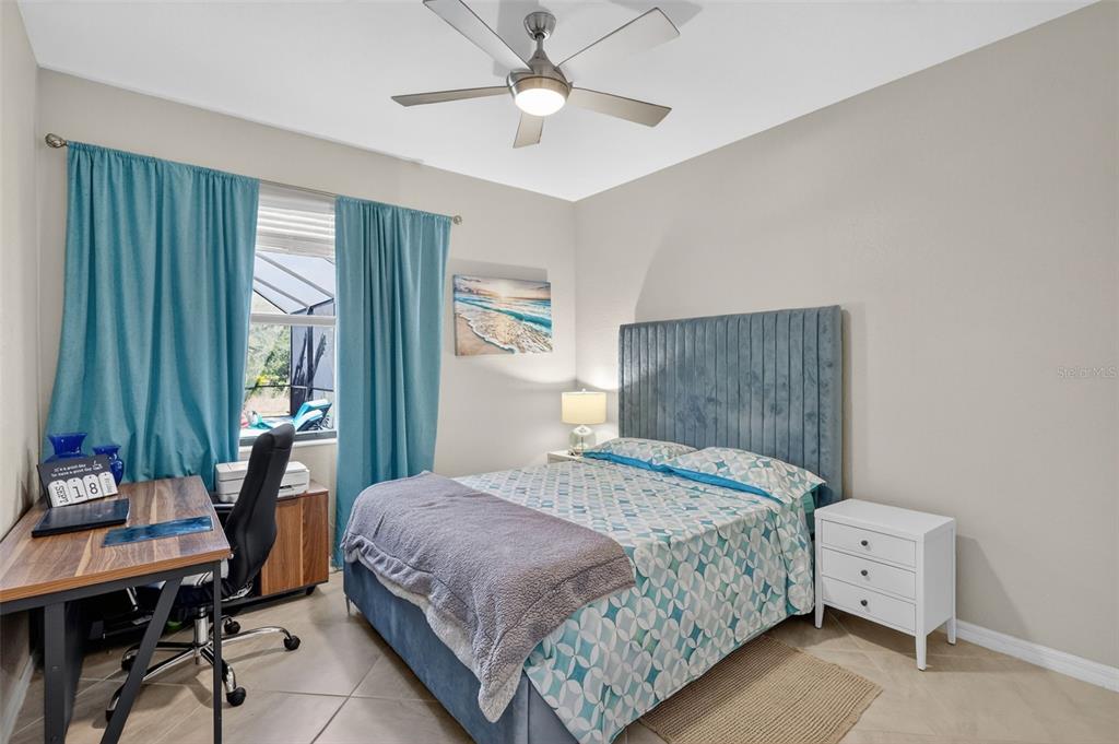 17619 Blue Rdg Place Bradenton, FL 34211 - Photo 46 of 98 a bedroom with a bed and a chandelier