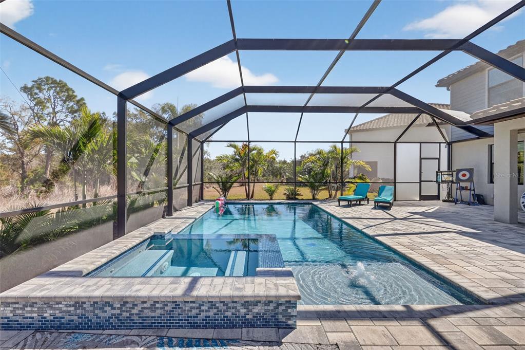 17619 Blue Rdg Place Bradenton, FL 34211 - Photo 52 of 98 a view of a swimming pool with a lounge chairs