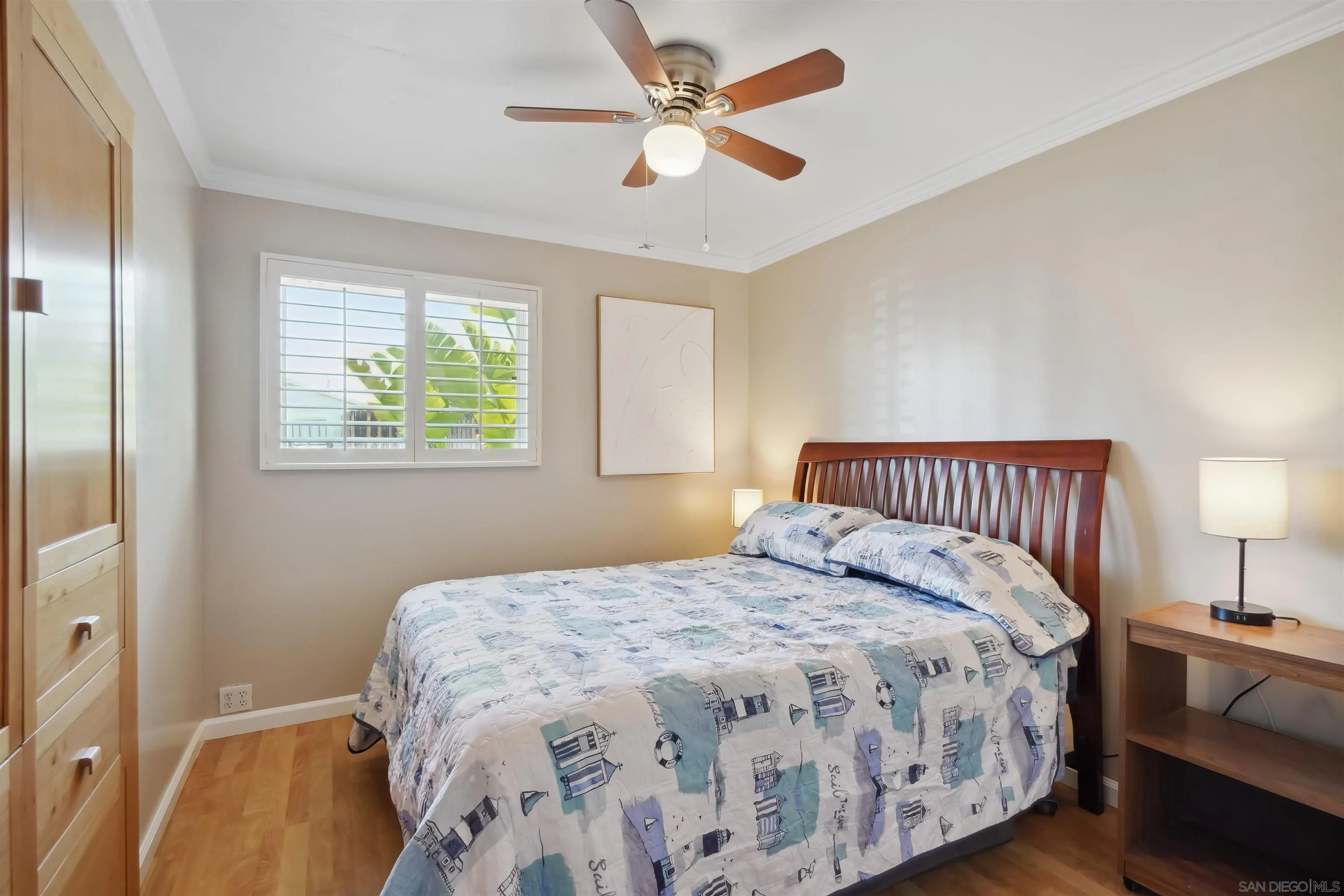 9537 East Hartland Circle Santee, CA 92071 - Photo 15 of 42 a bedroom with a large bed and a chandelier